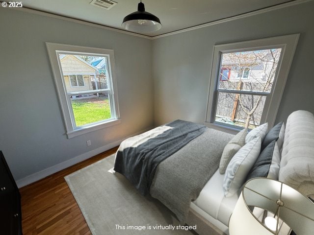 351 Juniper St, Junction City, OR 97448 - bedroom with visible vents, wood finished floors, and baseboards