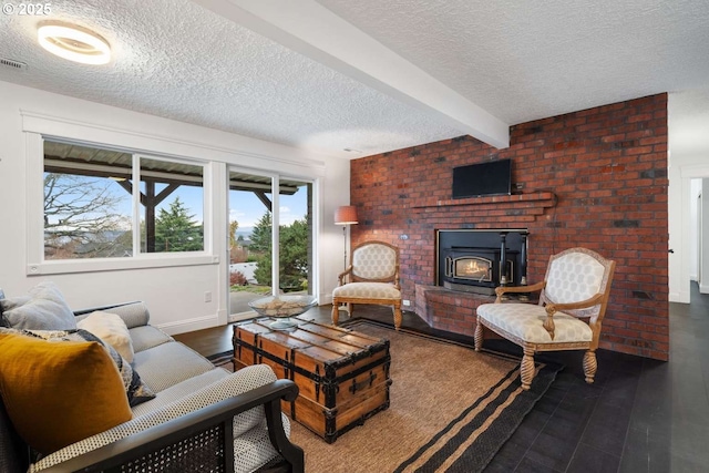 8014 SE Middle Way, Vancouver, WA 98664 - living room featuring a textured ceiling, beamed ceiling, and wood finished floors