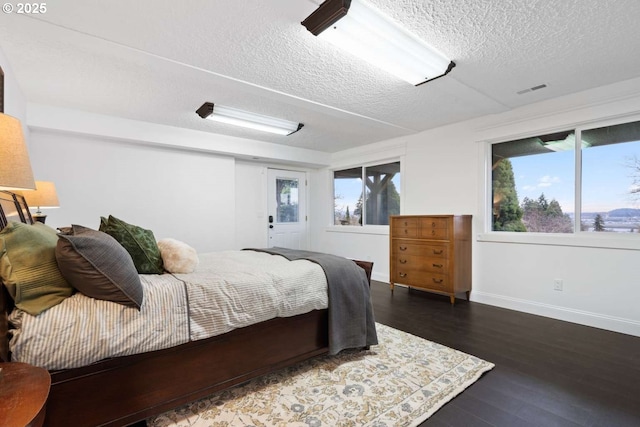 8014 SE Middle Way, Vancouver, WA 98664 - bedroom featuring a textured ceiling and dark wood-style flooring