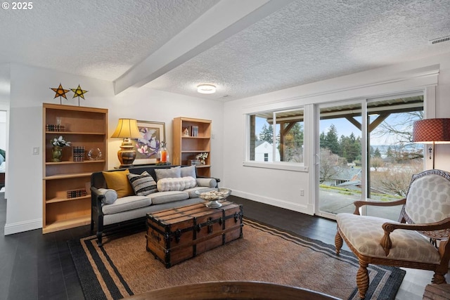 8014 SE Middle Way, Vancouver, WA 98664 - living room with a textured ceiling, healthy amount of natural light, wood finished floors, and beam ceiling