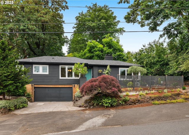 6945 SW 7th Ave, Portland, OR 97219 - view of front of property with a garage, driveway, a chimney, and brick siding