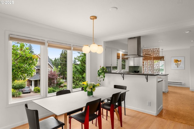 6945 SW 7th Ave, Portland, OR 97219 - dining space with baseboard heating, plenty of natural light, light wood-style floors, and recessed lighting