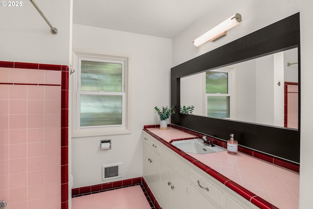 6945 SW 7th Ave, Portland, OR 97219 - bathroom featuring vanity, plenty of natural light, and tile patterned floors