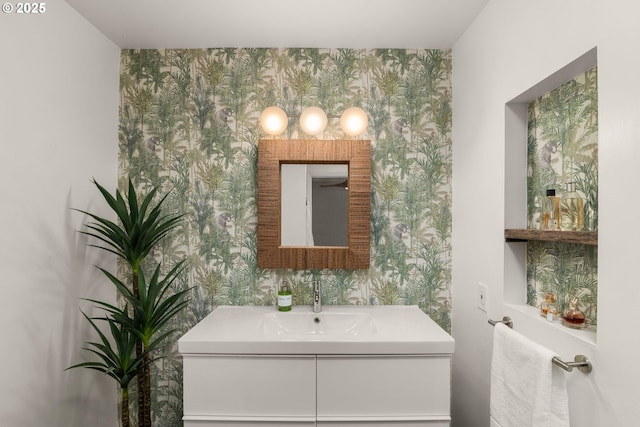 6945 SW 7th Ave, Portland, OR 97219 - bathroom with wallpapered walls, an accent wall, and vanity
