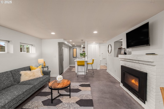 6945 SW 7th Ave, Portland, OR 97219 - living room featuring recessed lighting, a fireplace, and finished concrete flooring