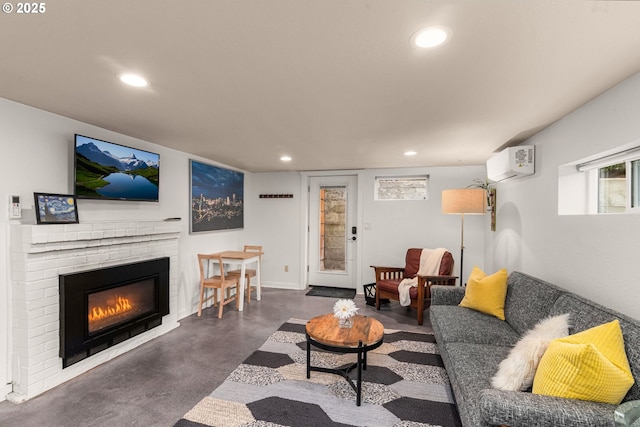 6945 SW 7th Ave, Portland, OR 97219 - living room with a wall mounted AC, finished concrete floors, recessed lighting, and a fireplace