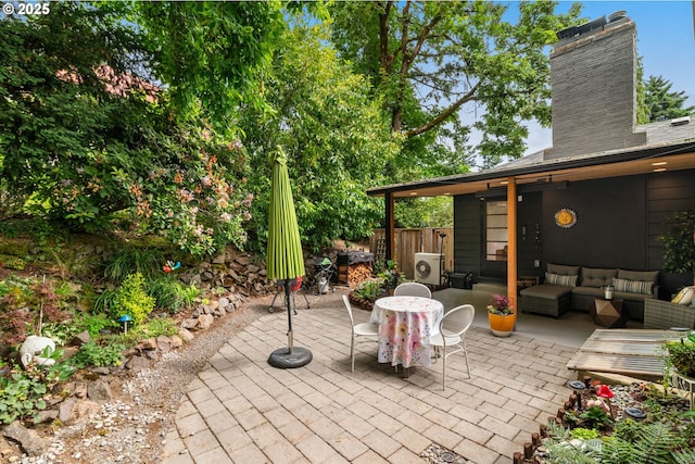 6945 SW 7th Ave, Portland, OR 97219 - view of patio featuring an outdoor living space and a grill