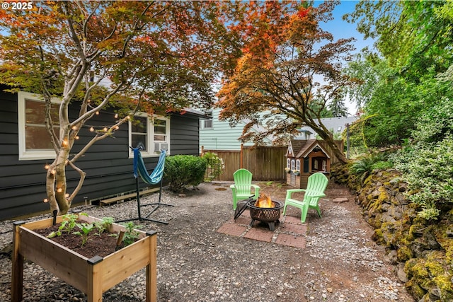 6945 SW 7th Ave, Portland, OR 97219 - view of yard with a fire pit and a garden
