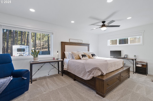 bedroom featuring a ceiling fan, recessed lighting, light carpet, and baseboards