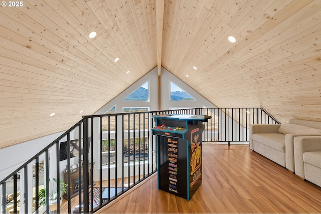 interior space featuring high vaulted ceiling, beamed ceiling, wood finished floors, and wood ceiling