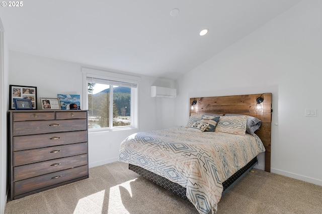 bedroom featuring baseboards, a wall unit AC, vaulted ceiling, and carpet flooring