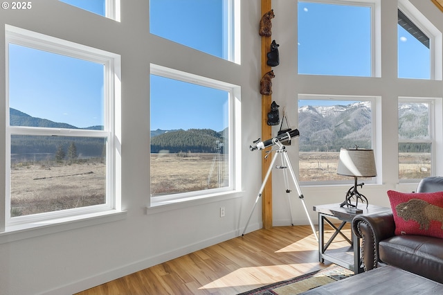 sunroom / solarium with a mountain view