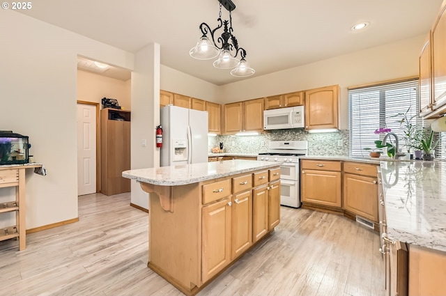 16371 SW Horseshoe Way, Beaverton, OR 97007 - kitchen with white appliances, a center island, light wood-style floors, light stone countertops, and recessed lighting