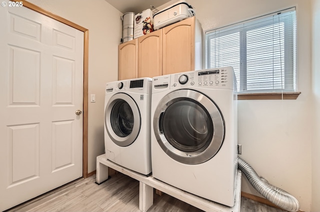 16371 SW Horseshoe Way, Beaverton, OR 97007 - washroom featuring cabinet space, light wood-type flooring, and washing machine and clothes dryer