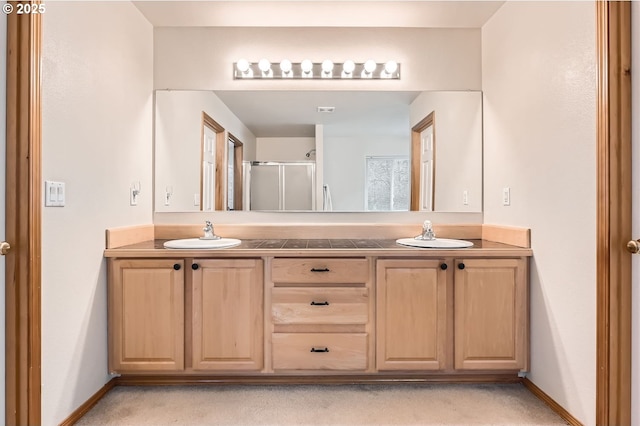16371 SW Horseshoe Way, Beaverton, OR 97007 - bathroom with double vanity, a shower stall, and baseboards