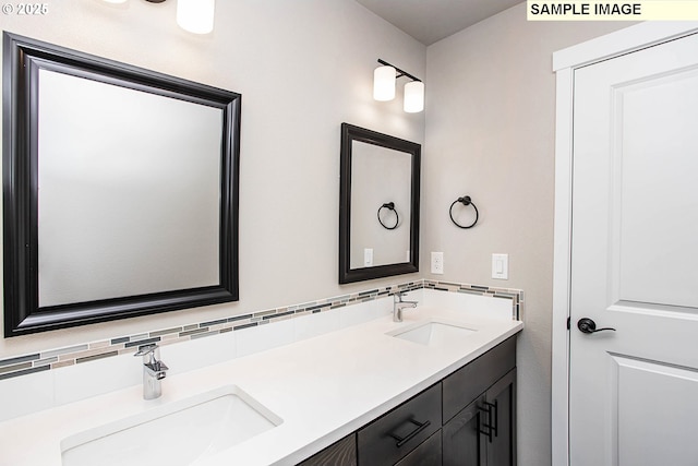 bathroom featuring tasteful backsplash and vanity