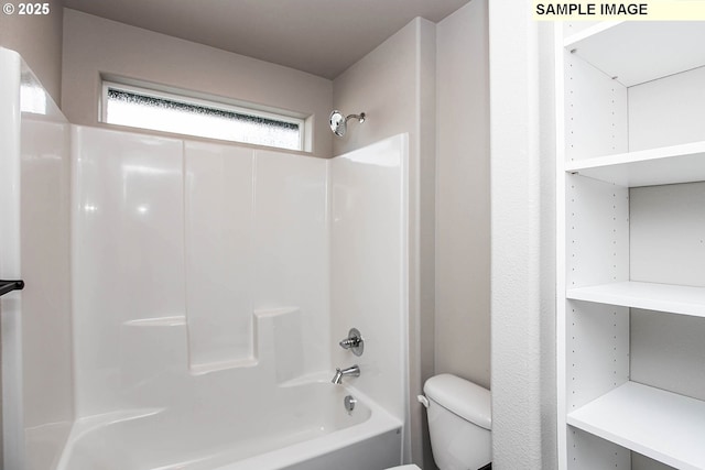 bathroom with shower / washtub combination and toilet