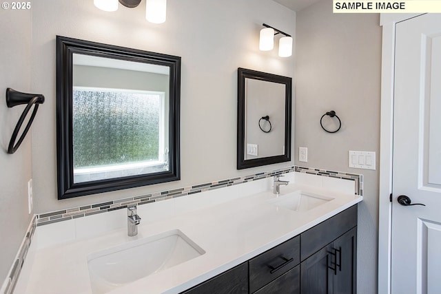 bathroom featuring vanity and decorative backsplash