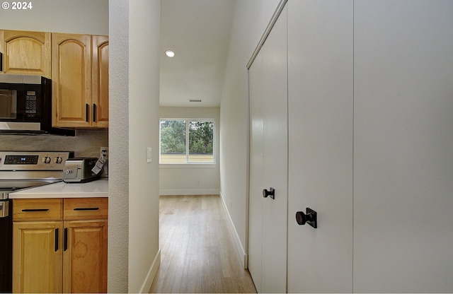 1611 NE 113th St, Vancouver, WA 98686 - kitchen with stainless steel range with electric stovetop, light wood-type flooring, and light countertops