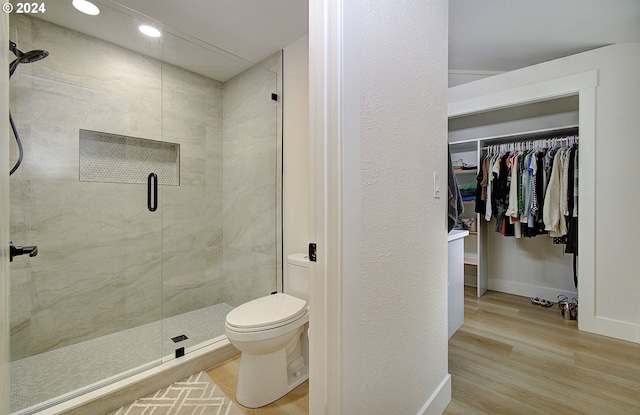 1611 NE 113th St, Vancouver, WA 98686 - bathroom with wood finished floors, a stall shower, a walk in closet, and recessed lighting