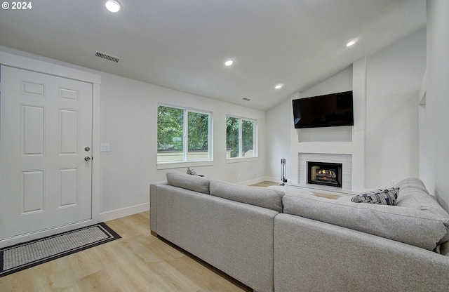 1611 NE 113th St, Vancouver, WA 98686 - living area with light wood-style floors, a lit fireplace, recessed lighting, and vaulted ceiling