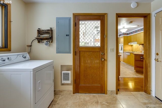 washroom featuring washer / clothes dryer, heating unit, and electric panel