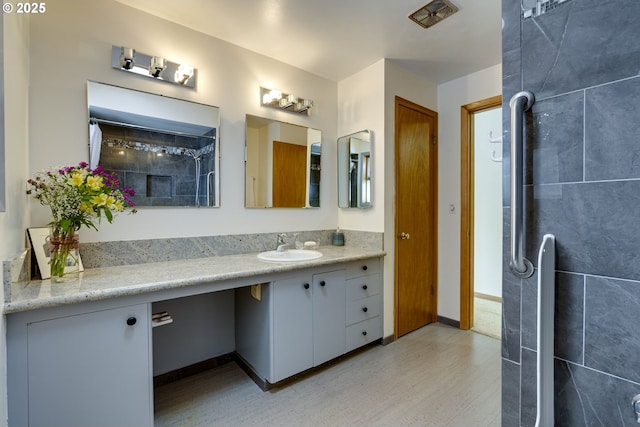 bathroom featuring hardwood / wood-style flooring and vanity