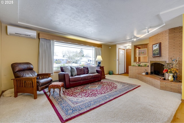 carpeted living room featuring an AC wall unit, a textured ceiling, and a fireplace