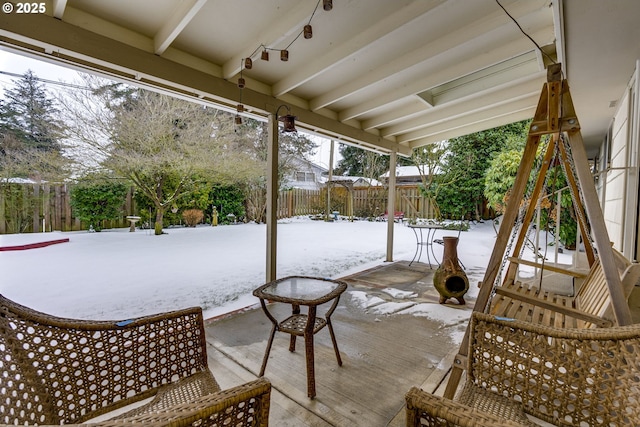 view of snow covered patio