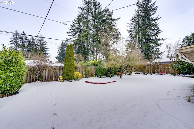 view of yard covered in snow