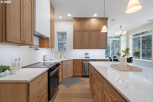 kitchen featuring visible vents, decorative backsplash, dishwasher, a sink, and range with electric stovetop