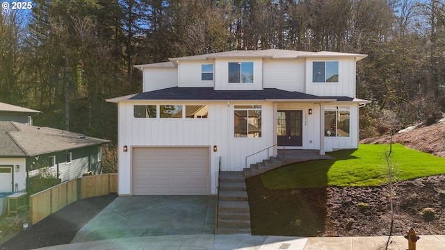 view of front of property featuring a garage, concrete driveway, and board and batten siding