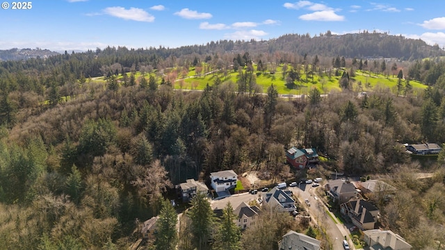 aerial view featuring a view of trees