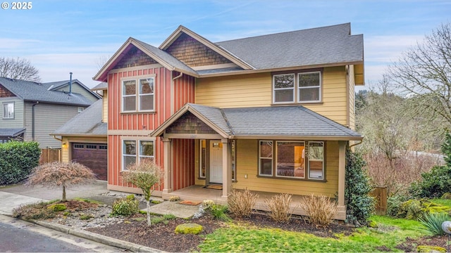 view of front of house featuring an attached garage, a shingled roof, board and batten siding, and concrete driveway