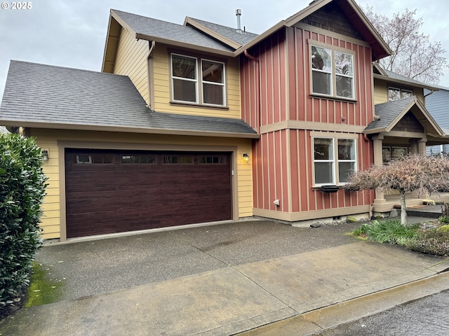 1267 SE Stapleton Loop, Gresham, OR 97080 - view of front of house featuring board and batten siding, asphalt driveway, an attached garage, and a shingled roof