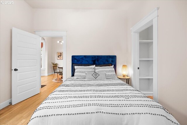 bedroom with hardwood / wood-style floors