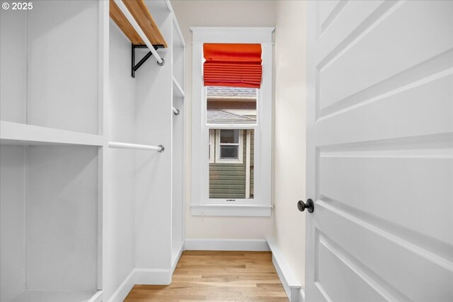 spacious closet featuring light wood-type flooring