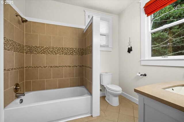 full bathroom featuring vanity, tile patterned floors, tiled shower / bath combo, and toilet