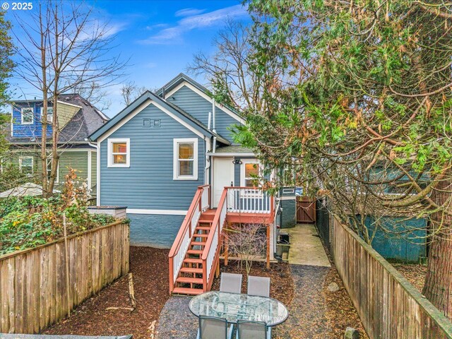 rear view of property with a deck