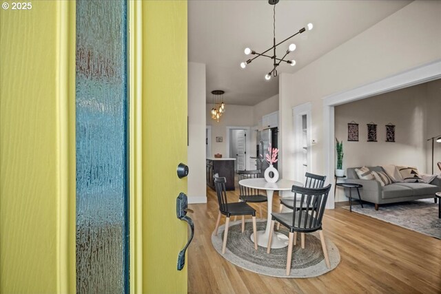 dining area with a chandelier and hardwood / wood-style floors