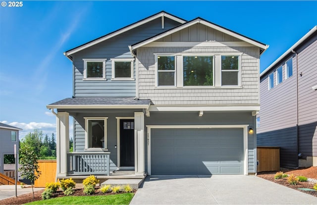 17437 NW Antonio St, Portland, OR 97229 - view of front facade with concrete driveway, a garage, covered porch, and a shingled roof