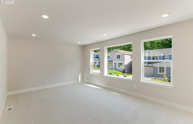 17437 NW Antonio St, Portland, OR 97229 - unfurnished room featuring healthy amount of natural light, carpet floors, baseboards, and recessed lighting