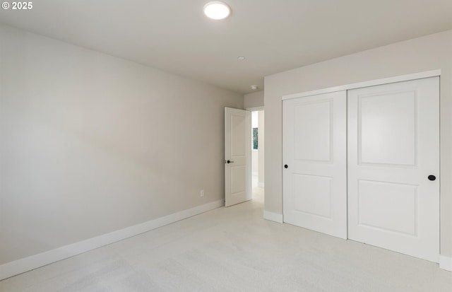 17437 NW Antonio St, Portland, OR 97229 - unfurnished bedroom with light colored carpet, baseboards, and a closet
