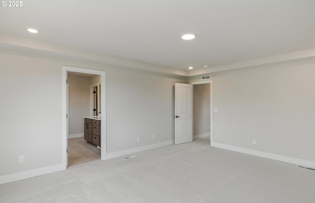 17437 NW Antonio St, Portland, OR 97229 - unfurnished bedroom with light carpet, recessed lighting, baseboards, and connected bathroom