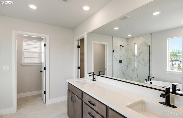 17437 NW Antonio St, Portland, OR 97229 - bathroom with a marble finish shower, double vanity, recessed lighting, baseboards, and tile patterned floors