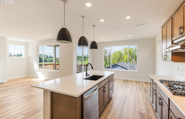 17437 NW Antonio St, Portland, OR 97229 - kitchen with a sink, appliances with stainless steel finishes, light wood-type flooring, light countertops, and recessed lighting