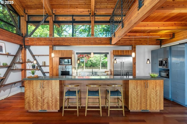 4183 SW Greenleaf Dr, Portland, OR 97221 - kitchen featuring built in appliances, dark countertops, wooden ceiling with exposed beams, dark wood-style floors, and a sink