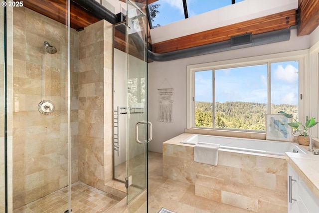 4183 SW Greenleaf Dr, Portland, OR 97221 - full bathroom featuring a stall shower, a bath, vanity, and tile patterned floors