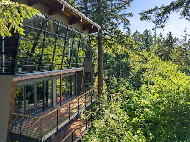 4183 SW Greenleaf Dr, Portland, OR 97221 - view of side of home with french doors and a forest view