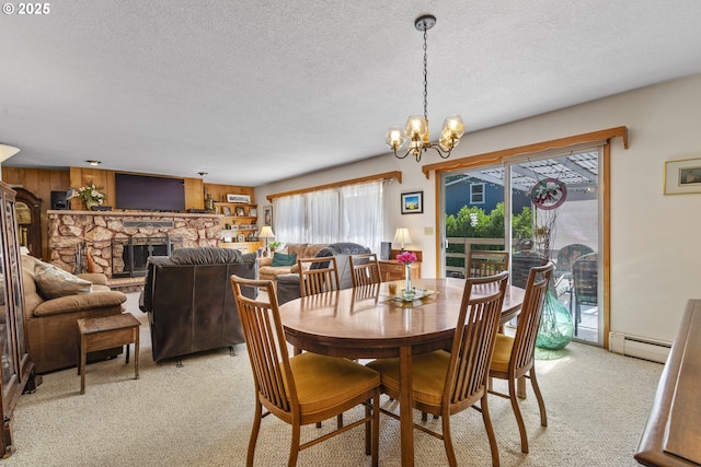 16828 Webster Rd, Gladstone, OR 97027 - dining area with a baseboard heating unit, light colored carpet, a textured ceiling, a chandelier, and a stone fireplace